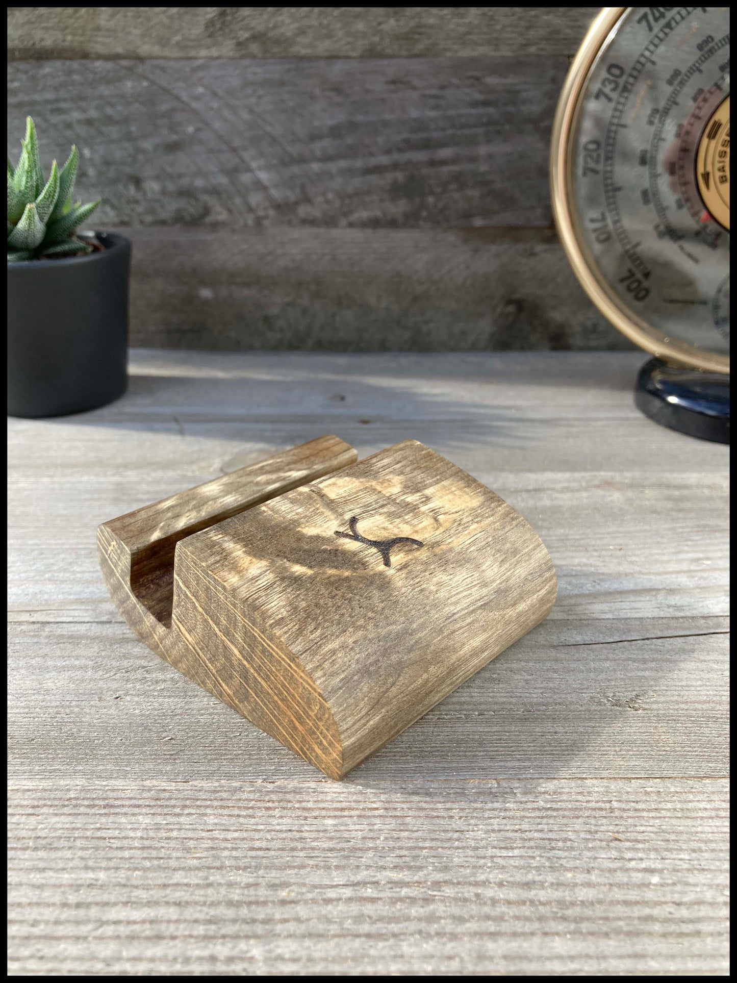 Solid wood phone holder with ebonized charm: an ebonized Telecharme