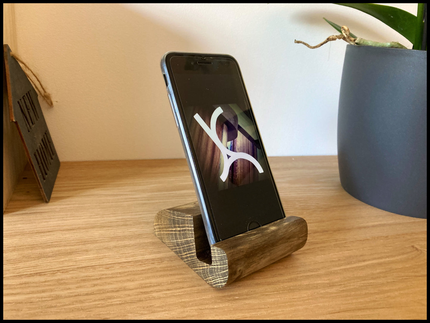 Solid wood phone holder with ebonized charm: an ebonized Telecharme